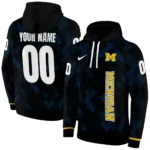 customized-michigan-wolverines-pixel-grid-blue-black-hoodie-best-selling.webp